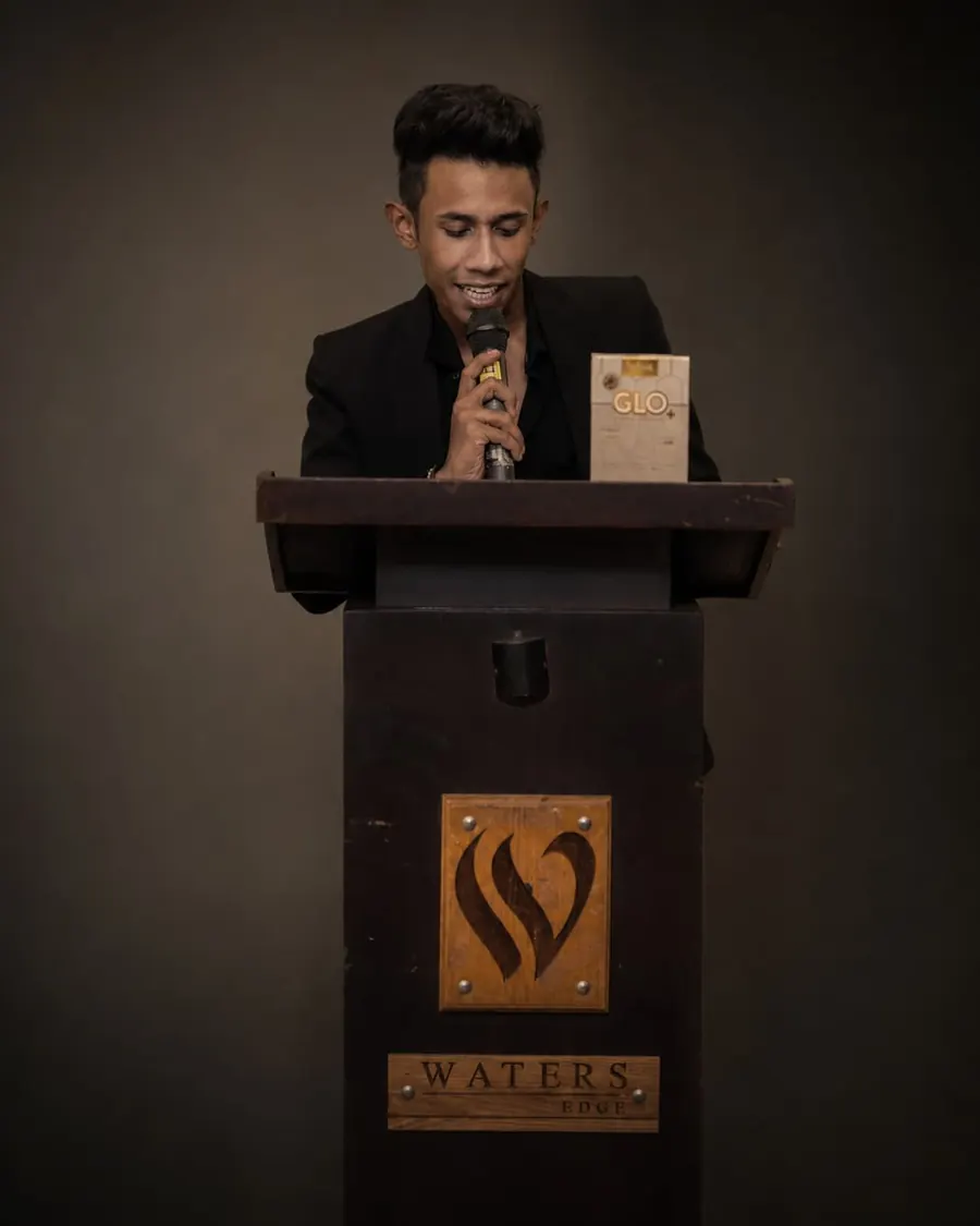 A TV Sri Lanka host on stage at a client event