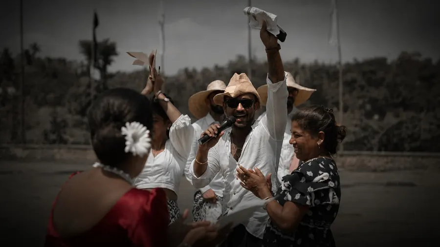 A host running an outdoor brand activation with a live crowd